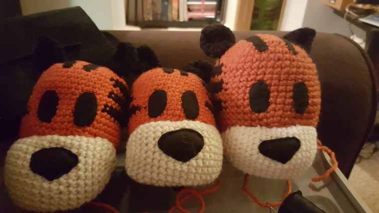Sewed on all the ears and muzzles to make fully formed Hobbes Heads!